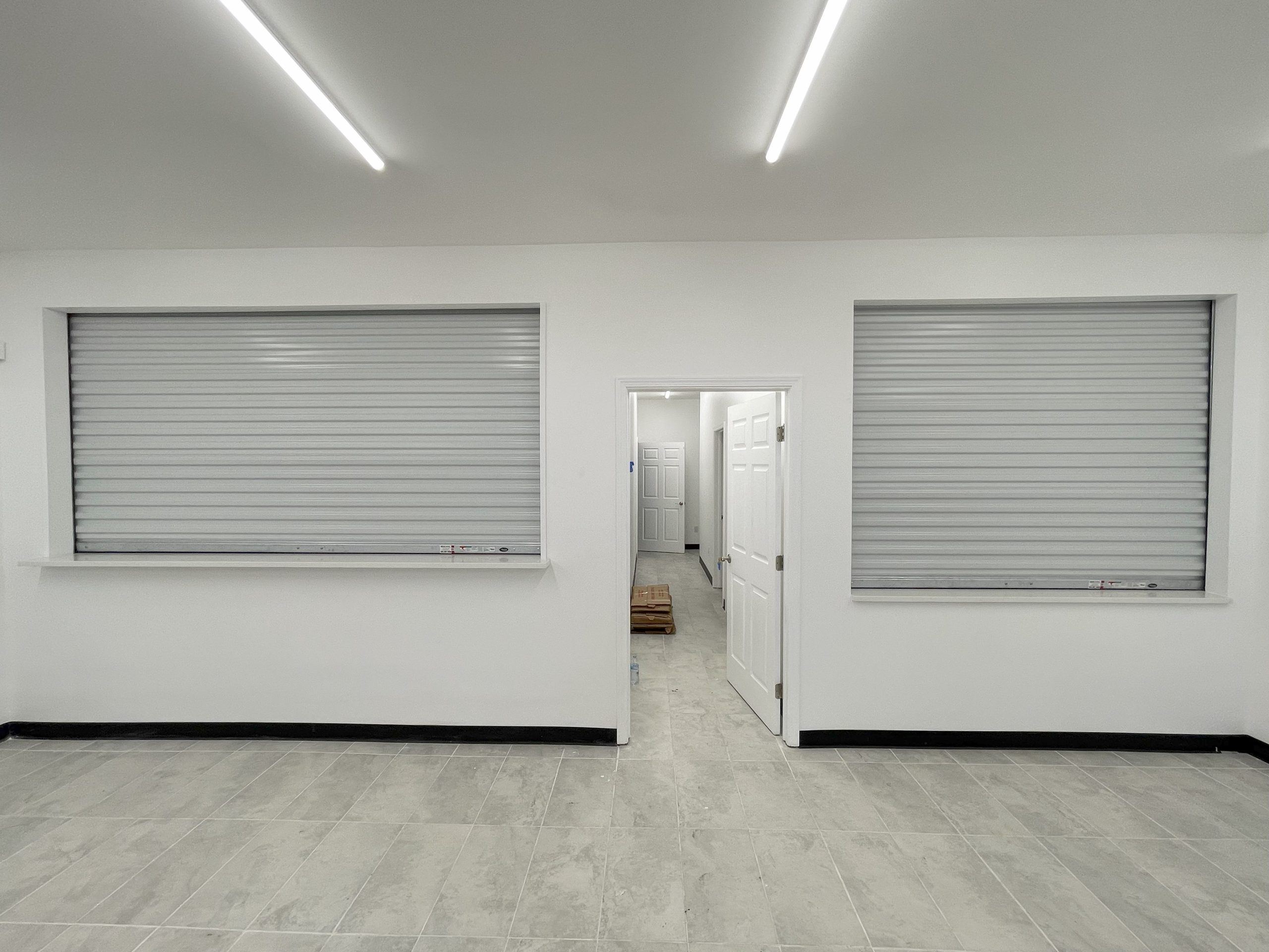 Rolling counter door securing a service window