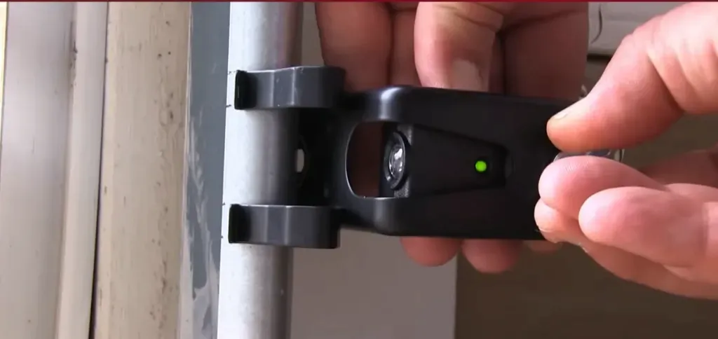 Garage door opener safety sensor alignment and wiring repair