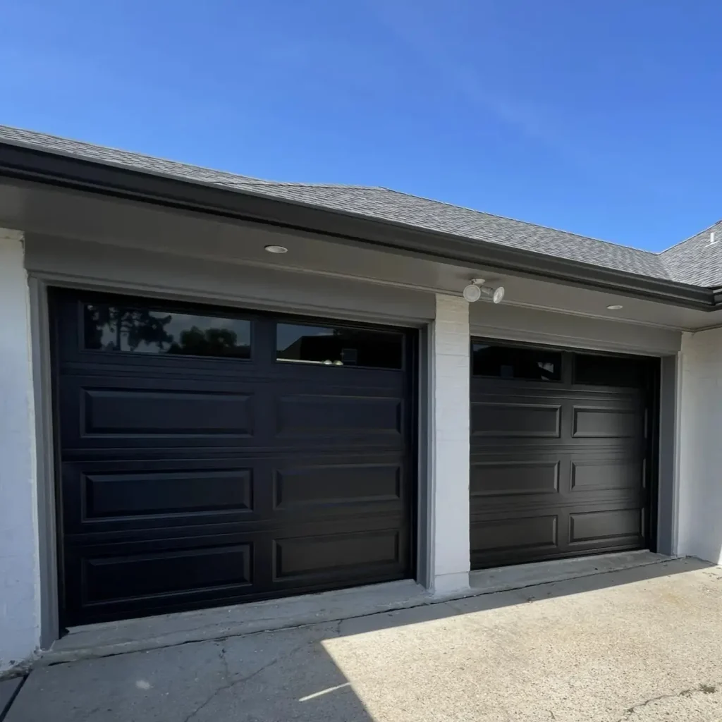 New dark brown raised-panel garage door installed on a New Orleans area home