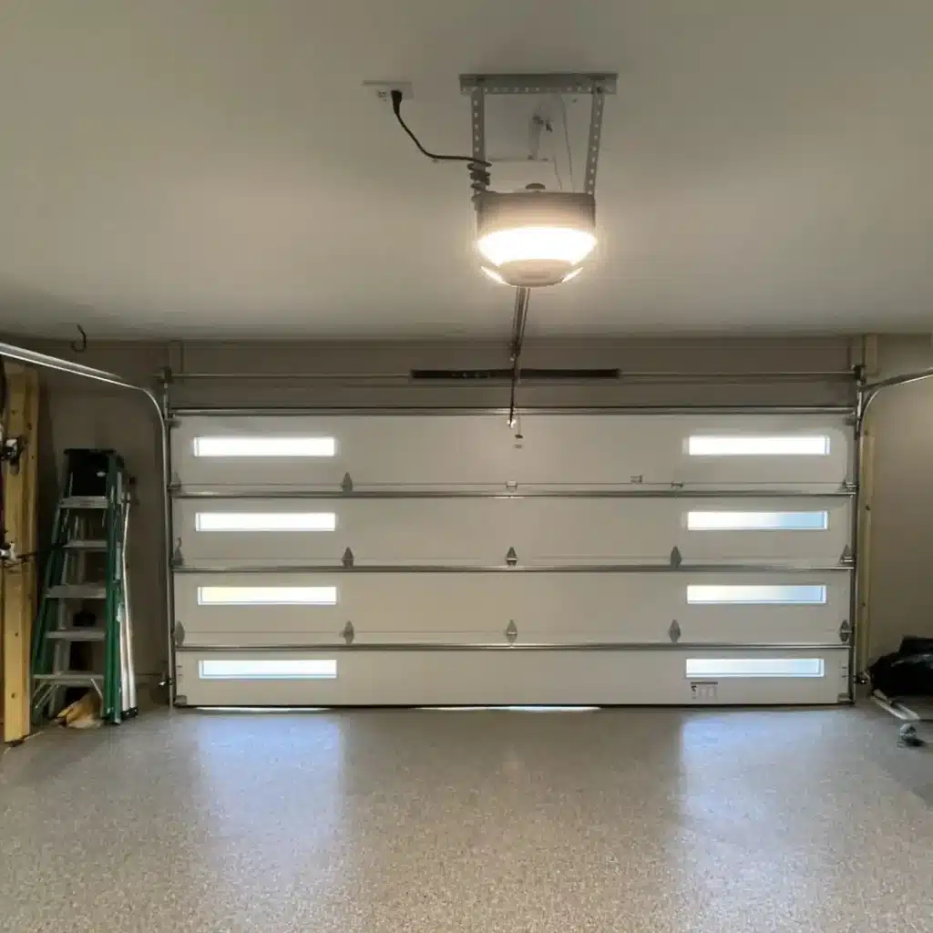 Interior view after modern garage door installation with window panels — New Orleans
