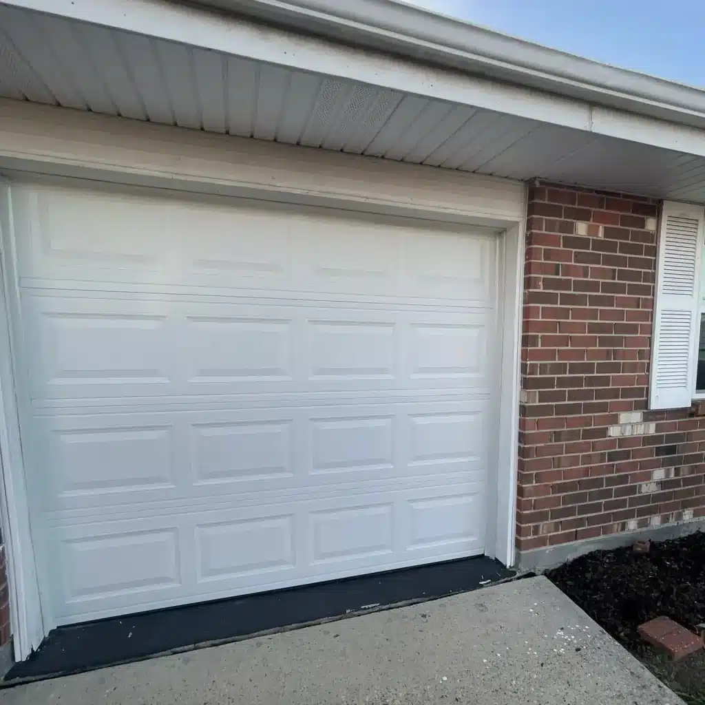 Reinstalled white panel garage door on a River Ridge, LA residential home