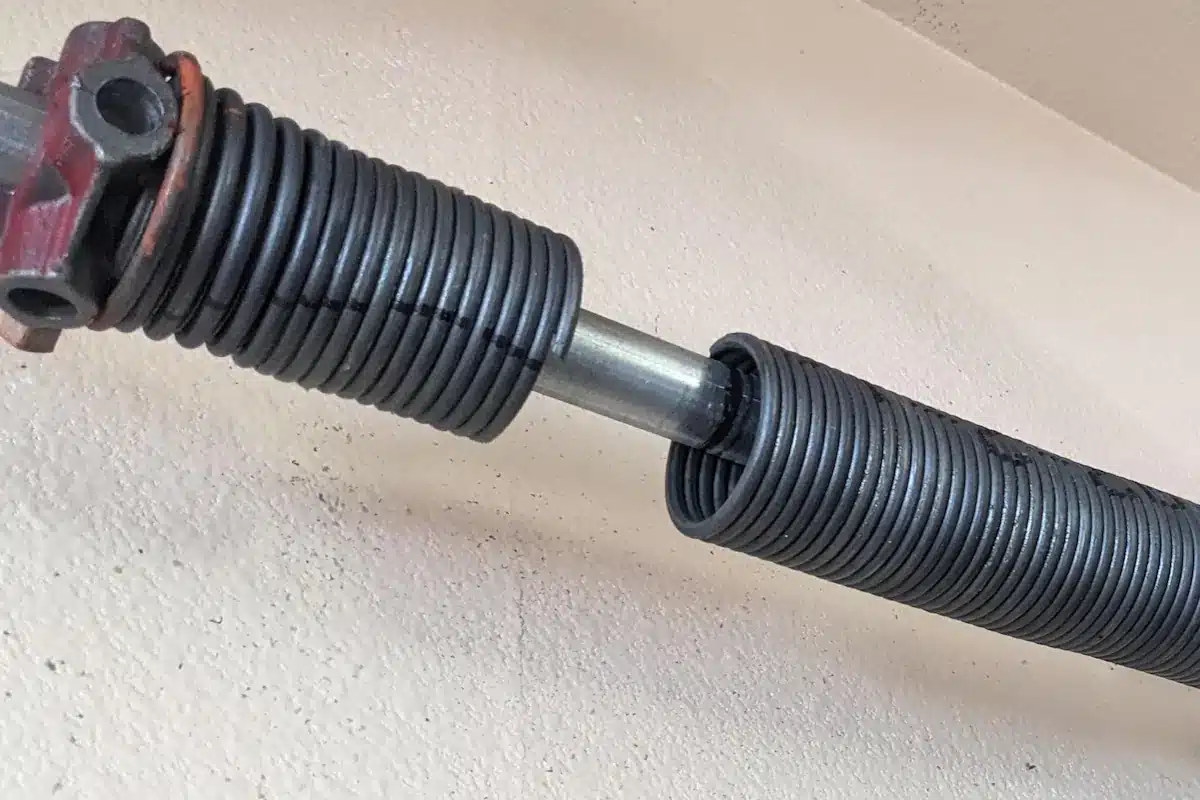 Broken torsion spring above garage door