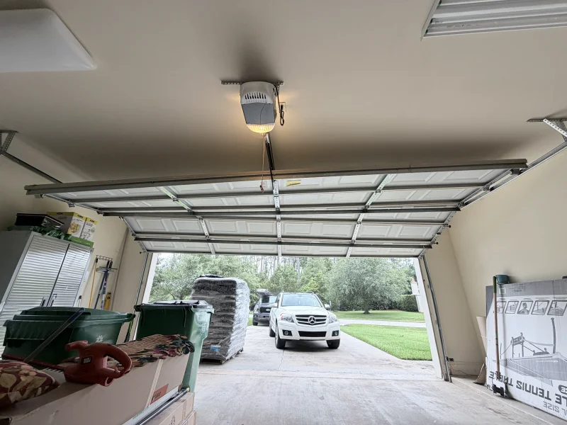 Garage door off track viewed from inside garage in New Orleans