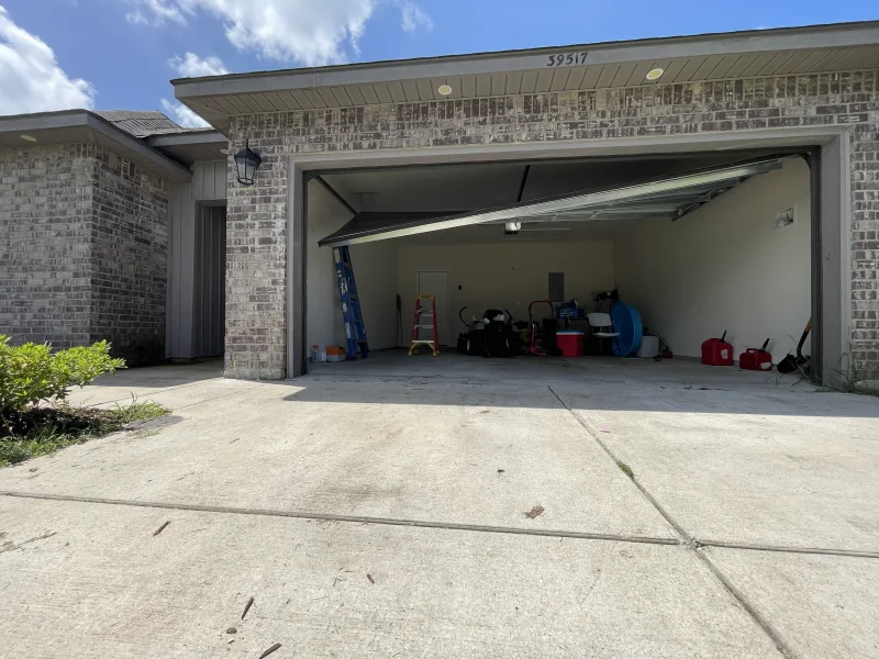 Garage door stuck open at a New Orleans home — security risk