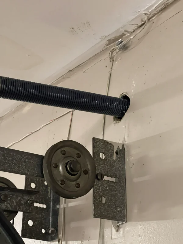 Broken torsion spring on a garage door in New Orleans